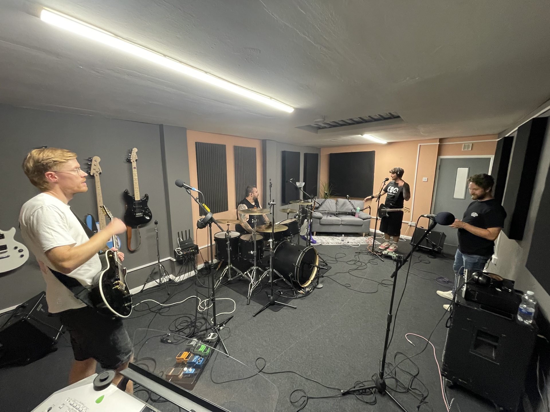 Band tracking live together in the studio live room