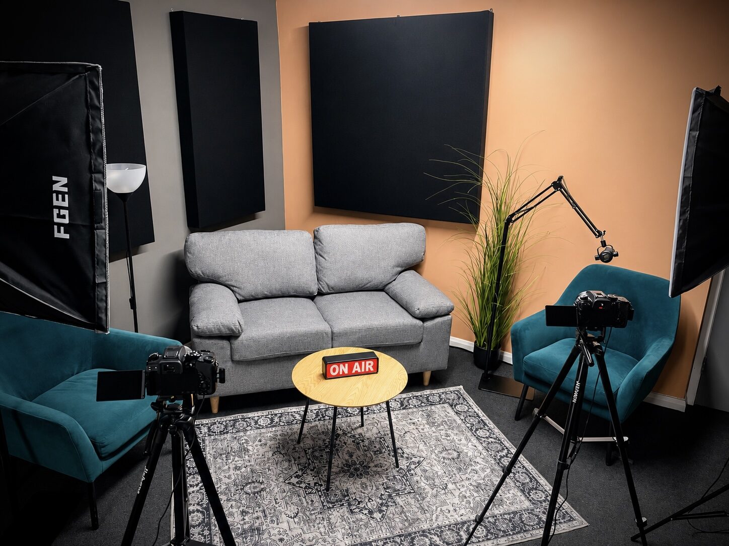 Podcast set with sofa, armchairs and on-air sign